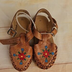 Brown and Red Moccasins with Beadwork and Fringe